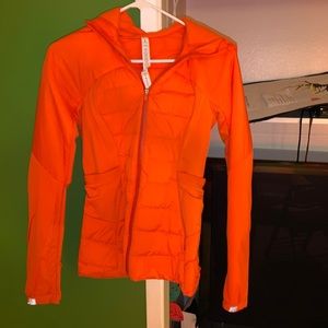 orange lululemon zip up hooded jacket